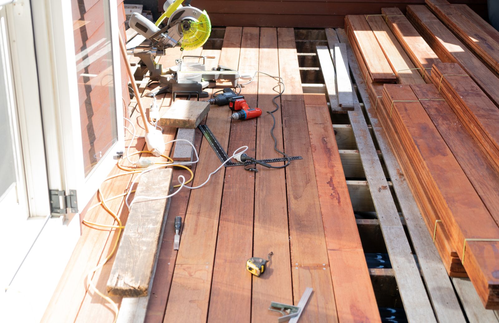 Fresh decking boards going down over existing framing